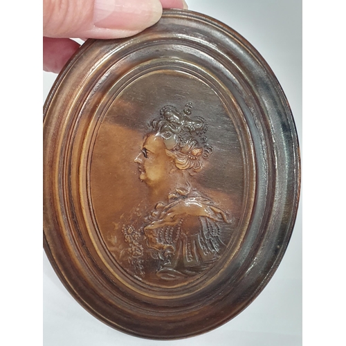 226 - An oval 18th Century Horn Box the lid impressed image of Queen Anne, inside lid inscribed 'Once Hann... 