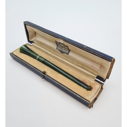 229 - A 1930's Nephrite Jade and Diamond Cheroot/Cigarette Holder millegrain-set a row of eight-cut diamon... 