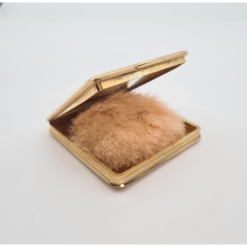 230 - A 1940's CARTIER 9ct gold square Powder Compact the lid applied claw-set oval-cut ruby within teardr... 