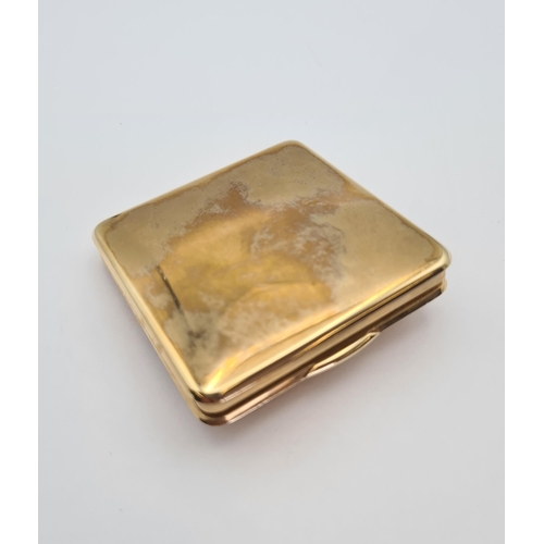 230 - A 1940's CARTIER 9ct gold square Powder Compact the lid applied claw-set oval-cut ruby within teardr... 