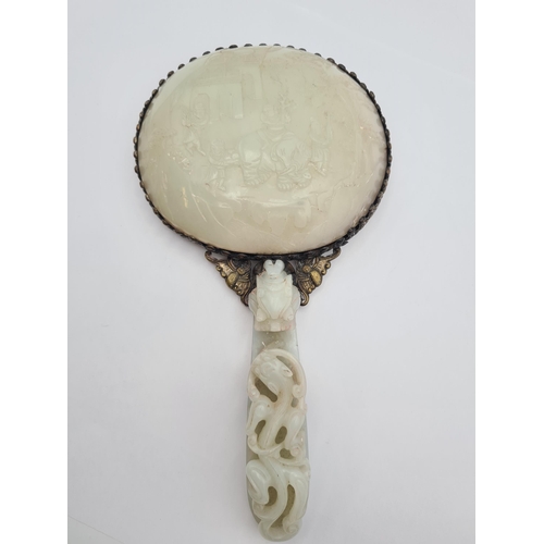 237 - A Hand Mirror formed from a carved Chinese Jade Buckle and carved Chinese Jade shallow Bowl with sil... 