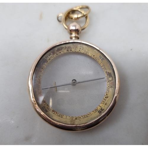 240 - Two gilt metal cased Pocket Compasses