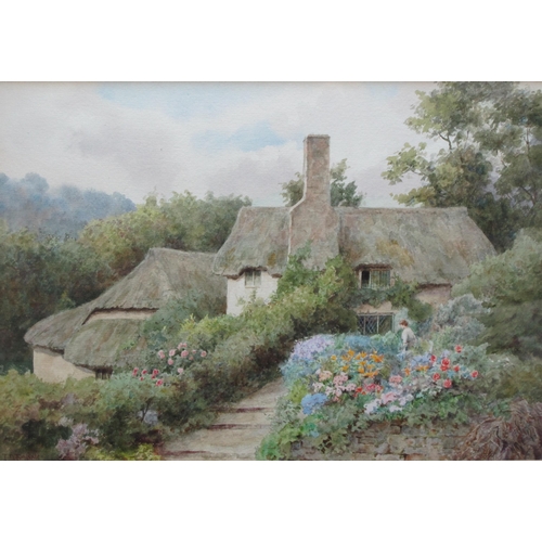 289 - THOMAS NICHOLSON TYNDALE (1860-1930). In a Cottage Garden, signed, watercolour, 9 x 13 in