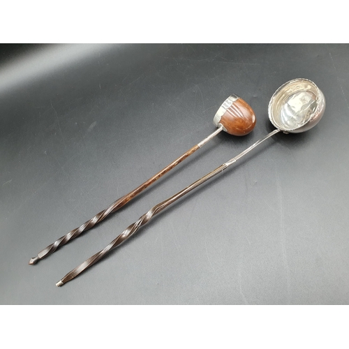 29 - Two antique Toddy Ladles, one with coccus bowl, the other silver, both with spiral whalebone handles