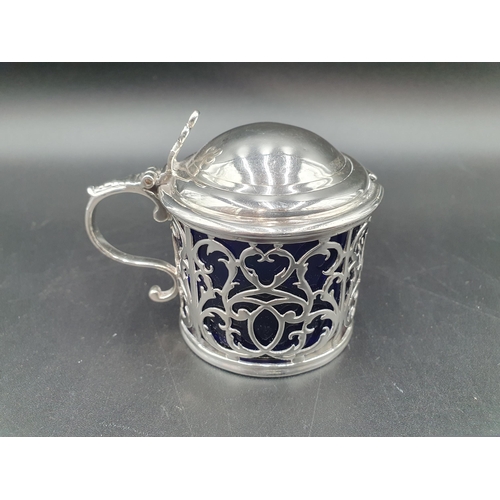 3 - A George III silver pierced Drum Mustard Pot with domed lid having pierced thumb piece, blue glass l... 