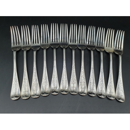 32 - A Victorian silver Set of Cutlery for twelve, old english pattern with bright cut decoration engrave... 