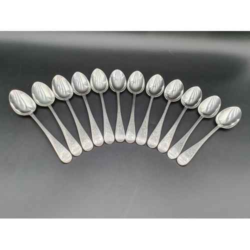 32 - A Victorian silver Set of Cutlery for twelve, old english pattern with bright cut decoration engrave... 