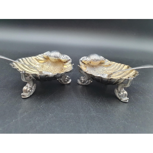 36 - A pair of Victorian silver scallop shape Salts on dolphin supports, Birmingham 1873, maker: George U... 