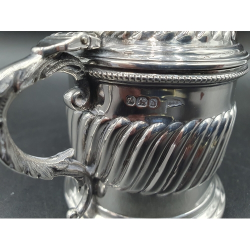 5 - A Victorian silver large Mustard Pot with gadroon embossing, scallop thumb piece, blue glass liner, ... 