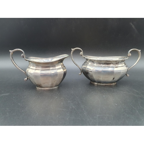 55 - A George V silver two handled Sugar Bowl and Milk Jug of panelled oval form, Birmingham 1926/7, 240g... 