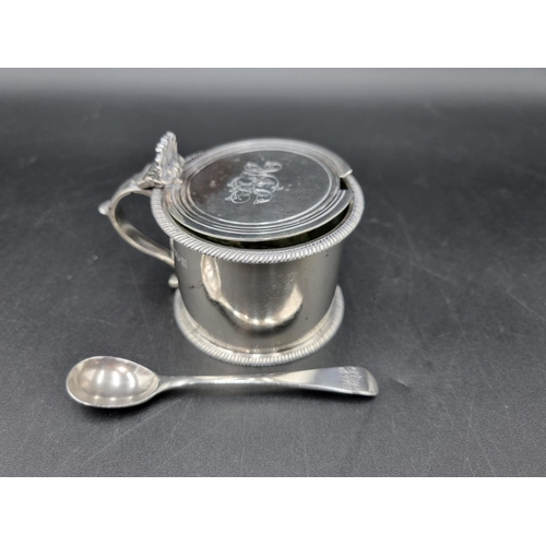 60 - An Edward VII silver Drum Mustard Pot with gadroon rim, clear glass liner, London 1908, and a Spoon,... 