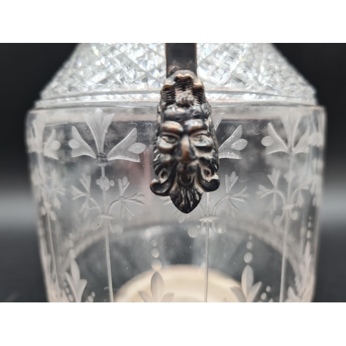 8 - A Victorian silver mounted and lidded cut glass Claret Jug with leafage engraved frieze, mask finial... 