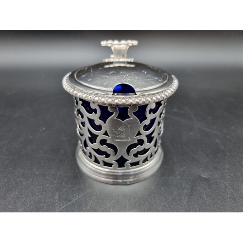 80 - A Victorian silver pieced Drum Mustard Pot with lobed rim, engraved crest, ornate thumb piece, blue ... 