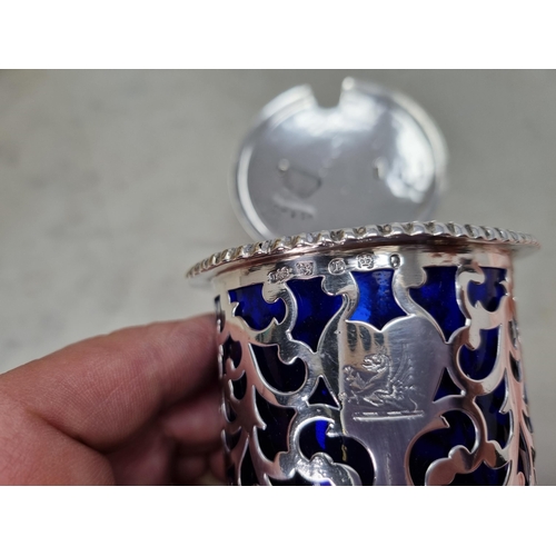 80 - A Victorian silver pieced Drum Mustard Pot with lobed rim, engraved crest, ornate thumb piece, blue ... 