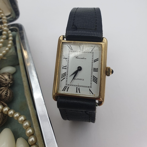 152 - A Circadian quartz Wristwatch the white rectangular dial with roman numerals in 9ct gold case, case ... 