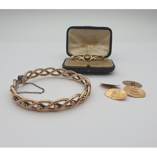 175 - A hinged Bangle of twisted form, a Pair of oval Cufflinks and an Art Nouveau Brooch set step-cut per... 