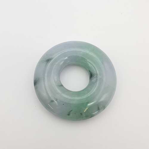176 - A circular Jade Pendant, approx 5.5cm diameter
