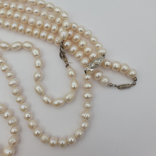 184 - Three opera length strings of Cultured Freshwater Pearls, one with large amethyst bead to front