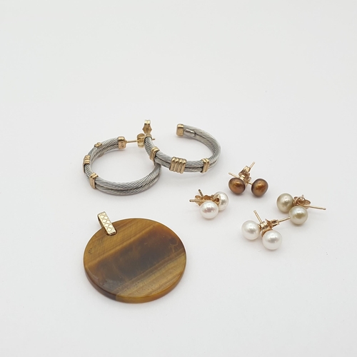 212 - A Tiger's Eye Disc Pendant, a pair of Hoop Earrings and white and yellow metal stamped 375 and four ... 