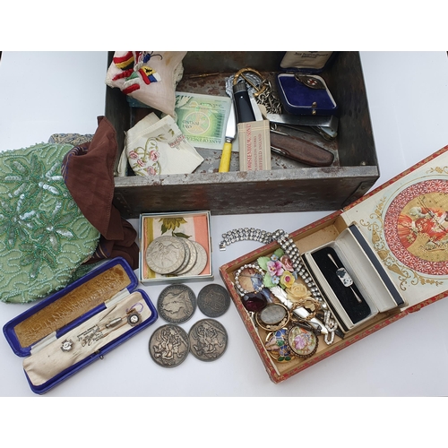 214 - An old Strong Box containing; Costume Jewellery, various Crowns, Evening Purse, Pen Knives etc