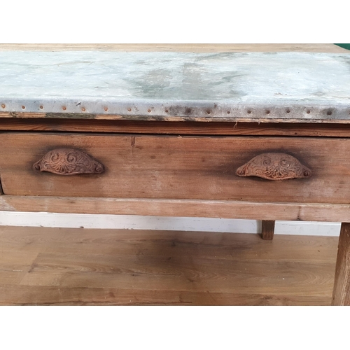 39 - A pine Table with half zinc top, with pair of fitted drawers and raised on square tapered supports, ... 