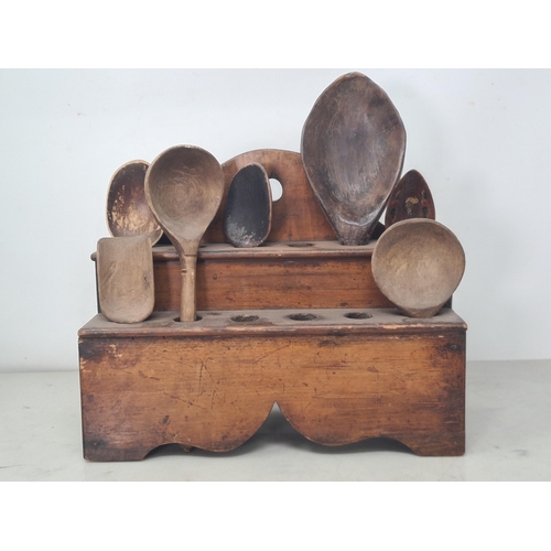 40 - An antique pine Spoon Rack 12in W x 10in H with seven wooden Spoons (R3)