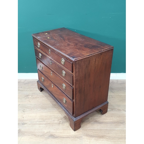 42 - A 19th Century mahogany Chest of four long graduated drawers, with ring handles, and raised on brack... 