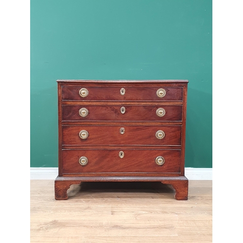 42 - A 19th Century mahogany Chest of four long graduated drawers, with ring handles, and raised on brack... 