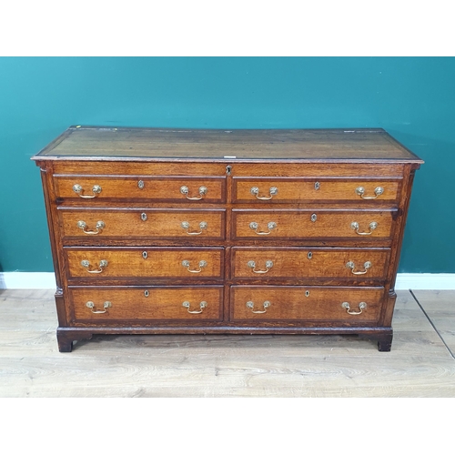 50 - An 18th Century oak and mahogany crossbanded Chest fitted four dummy drawers above four drawers rais... 