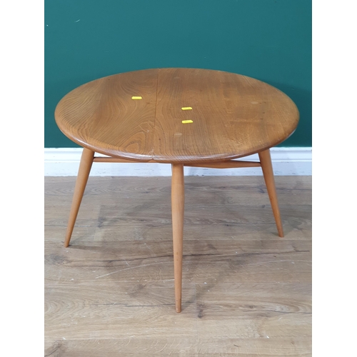 502 - A light elm Ercol Dropleaf Coffee Table on tapered supports, 16