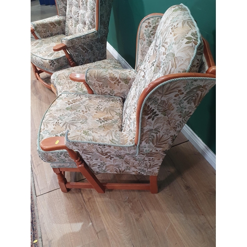 507 - A pair of Ercol winged Armchairs 3ft 2in H x 2ft 6in W  and a Footstool (R4)