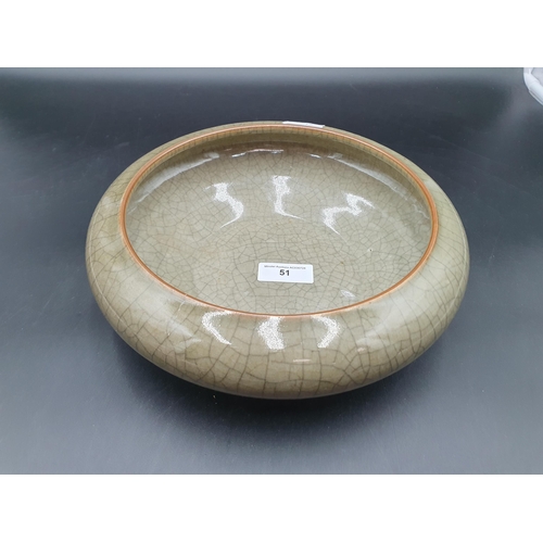 51 - A Chinese celadon Bowl with crackle glaze, 11in diam, incised square mark under
