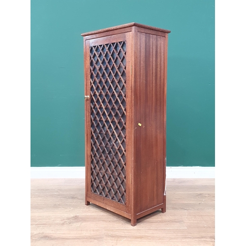 546 - A modern hardwood Cupboard/Music Cabinet with glazed and lattice work single door, A/F, 44