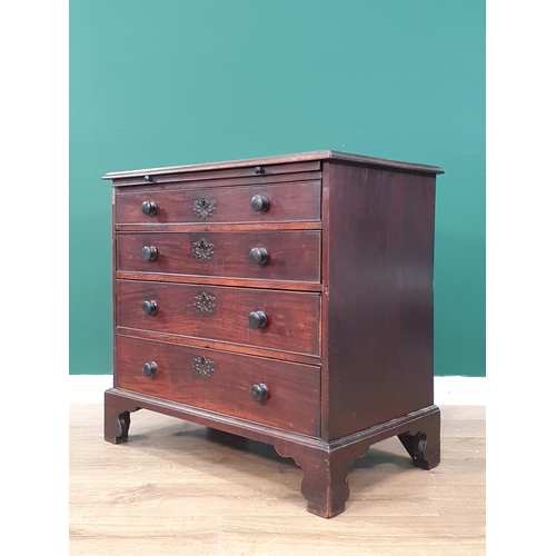 549 - A 19th Century Batchelors Chest with brush slide above four graduated drawers raised on bracket feet... 