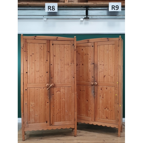 550 - A pair of modern Pine two door Cupboards with fitted shelves, with shaped friezes and square support... 