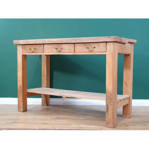 552 - A Kitchen Prep Table with thick two piece top, above three fitted drawers, on square supports and po... 