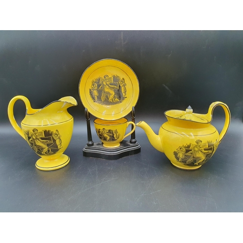 56 - A 19th century canary ground pottery Teapot, Jug, Cup and Saucer monochrome printed musicians, etc, ... 