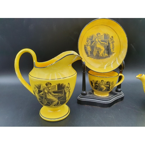 56 - A 19th century canary ground pottery Teapot, Jug, Cup and Saucer monochrome printed musicians, etc, ... 