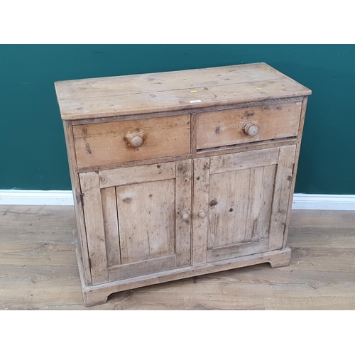 560 - A 19th Century pine Cupboard fitted two frieze drawers above pair of cupboard doors on bracket feet ... 