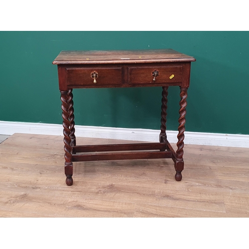 565 - An oak Side Table fitted two frieze drawers raised on barley twist supports united by double H-stret... 