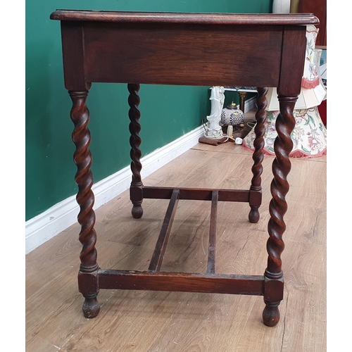 565 - An oak Side Table fitted two frieze drawers raised on barley twist supports united by double H-stret... 