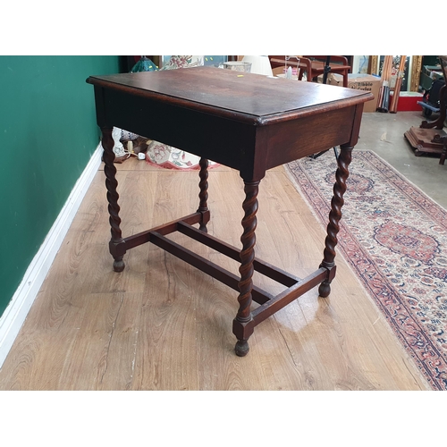 565 - An oak Side Table fitted two frieze drawers raised on barley twist supports united by double H-stret... 