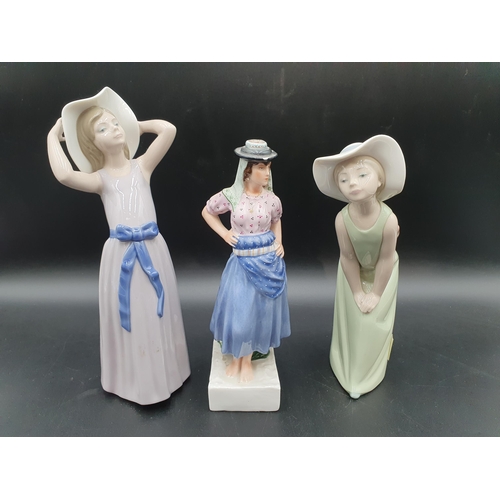 58 - Two Lladro Figures of girls in long dresses, 9in and a Portuguese Lady wearing blue dress