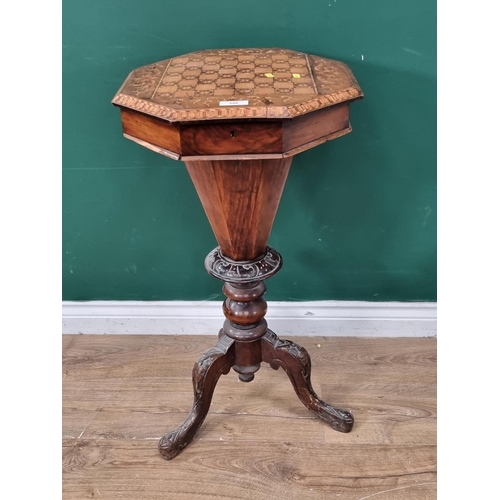 588 - A walnut trumpet Sewing/Games Table, the top with inlaid chequer board top, the interior with multip... 