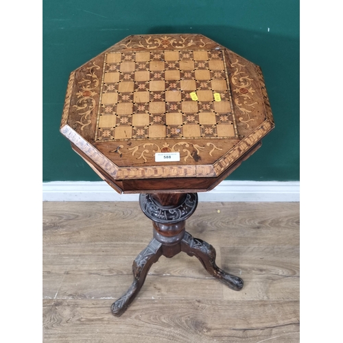 588 - A walnut trumpet Sewing/Games Table, the top with inlaid chequer board top, the interior with multip... 