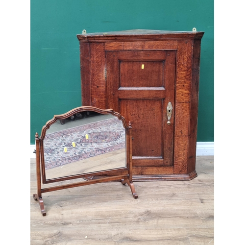 596 - An antique oak hanging Corner Cupboard 3ft H x 2ft 5in W and a walnut framed Dressing Mirror (R6)