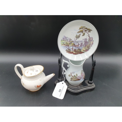 60 - An 18th century porcelain Cream Jug with colour printed landscape reserves, 3 1/2in, repairs and han... 