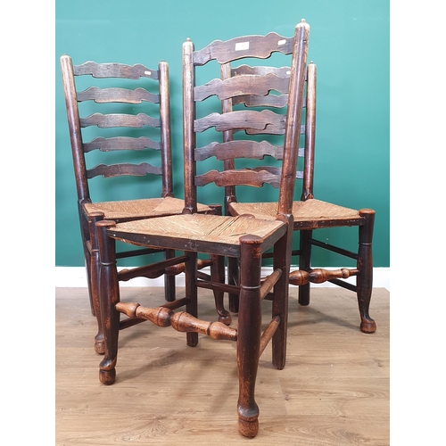 71 - A set of three Yorkshire ash ladderback Dining Chairs with rush seats on turned supports, (R10)