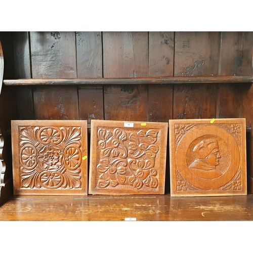 75 - Three antique oak Panels, two with carvings of rosettes and flowers and the other a religious bust f... 