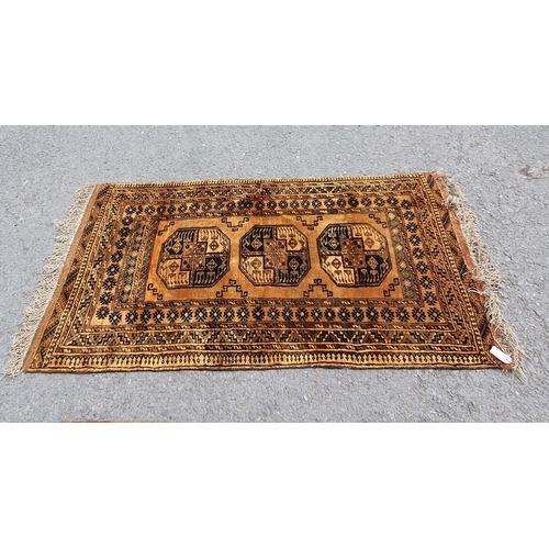 831 - A yellow ground Rug with multiple geometric borders, with three central octagonal motifs, 6ft 9